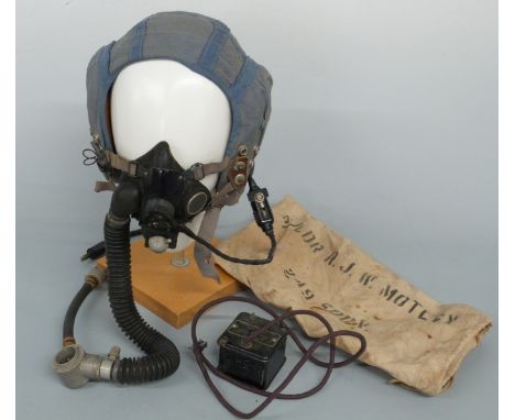 Post WWII RAF blue flying helmet with oxygen mask and transformer in bag named S/LDR R J W Motley 249 Sqd, dated 1963