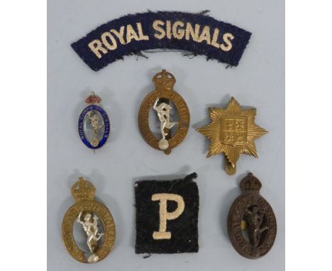 Three Royal Corps of Signals badges including a plastic example by Stanley & Sons, Walsall together with a similar enamel bad