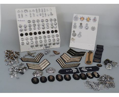 A large collection of police insignia, badges, buttons, shoulder titles, helmet fittings etc 