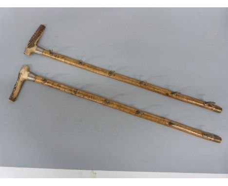 A campaign/ travelling whip shelf/rack in two parts with brass hanging facility one end and deer antler handles the other, 77