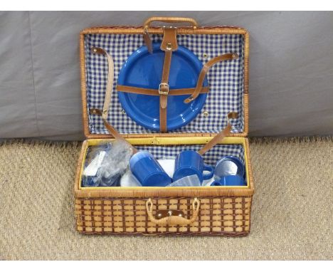 A picnic hamper and contents