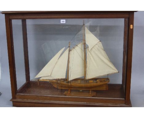 A 20TH CENTURY WOODEN SCRATCH BUILT MODEL OF THE 19TH CENTURY RACING YACHT, 'AMERICA', modelled at full sail and in a glazed 