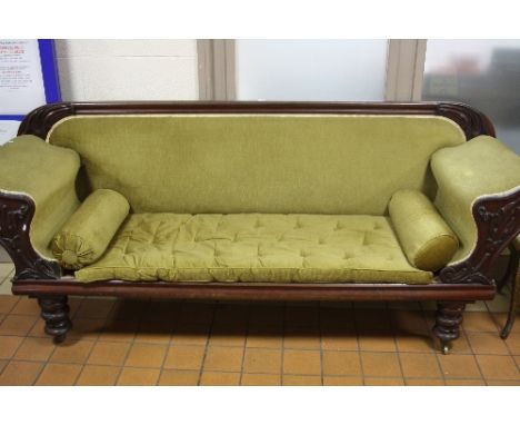 A VICTORIAN MAHOGANY FRAMED SOFA, leaf moulded detail to the back above scrolled arms with moulded foliate decoration, loose 