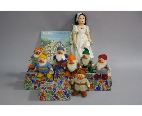 A SET OF BOXED CHAD VALLEY SNOW WHITE AND THE SEVEN DWARFS DOLLS, 1930's felt and cloth dolls with painted features, all appe