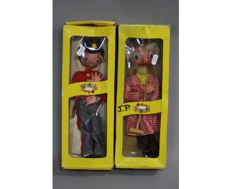A BOXED PELHAM FARMER PUPPET, no. SM3, version with moving jaw, with a boxed Pelham Soldier Fritzl, no. SS7, both in damaged 