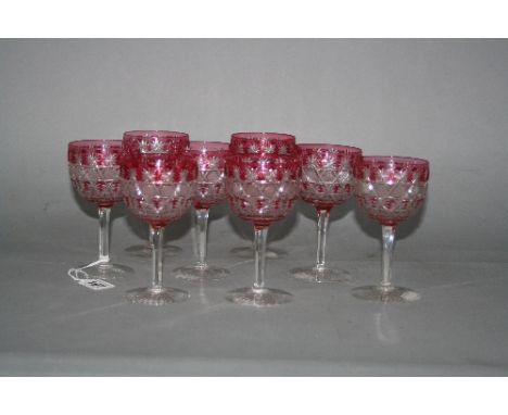 A SET OF EIGHT STOURBRIDGE CAMEO GLASSES, c.1880, having banded floral and geometric clear and ruby glass bowls over slice cu