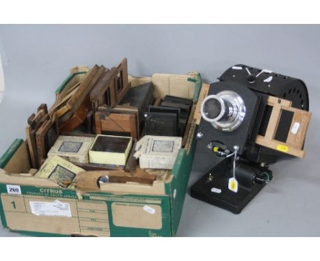 A COLLECTION OF VICTORIAN AND LATER MAGIC LANTERN SLIDES, including Kaleidoscope effect and others with turning handles and s