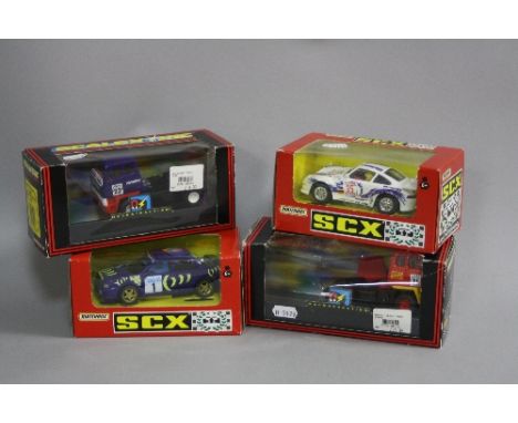 TWO BOXED SCALEXTRIC LEYLAND ROADTRAIN RACING TRUCKS, Dermon Tweeks, no. C2070, and Valvoline, no. C2071, with a boxed Matchb