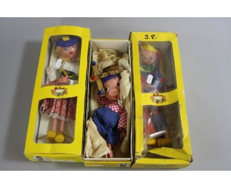 A BOXED PELHAM PINKY PUPPET, no. SS9, with a boxed Pelham Clown, no. SS6, and a boxed Mitzi, no. SS8, with instructions, all 