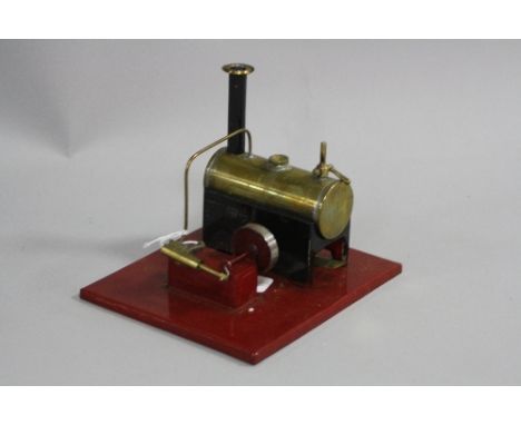 AN UNMARKED LIVE STEAM ENGINE, not tested, mounted on tinplate plinth