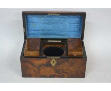 A VICTORIAN WALNUT RECTANGULAR DOME TOP TEA CADDY, by Farthing & Thornhill of 42 Cornhill, the interior with blue silk lined 