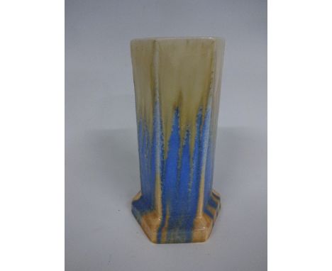 A RUSKIN POTTERY HEXAGONAL, STEPPED BASE VASE, having yellow, blue and orange drip crystalline glaze with blue flecks, tube l