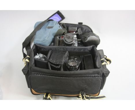 A CAMERA BAG, containing a Minolta Dynax 700si SLR camera fitted with a 28-80mm 1:4 lens, a Minolta 50mm 1:1.7 lens, a Tele p