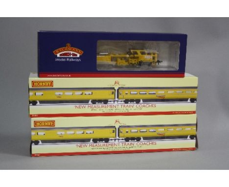 A BOXED BACHMANN HO GAUGE PLASSER AND THEURER TAMPING MACHINE, no. DX73208 (36-165A), complete with instructions, with two bo