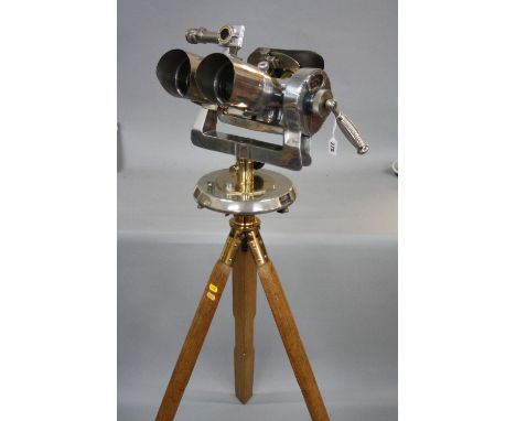 A PAIR OF KRIEGSMARINE BATTLESHIP BINOCULARS, steel and brass, with levels, mounted on a wooden and brass tripod, restored