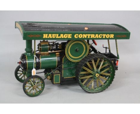A SCRATCH BUILT (20TH CENTURY) WOODEN AND METAL STEAM ENGINE, green, black, red and yellow livery, the wooden roof painted 'R