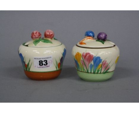 A CLARICE CLIFF BIZARRE CROCUS PATTERN PRESERVE POT AND COVER, another in Spring Crocus pattern, both shape No.230, printed m