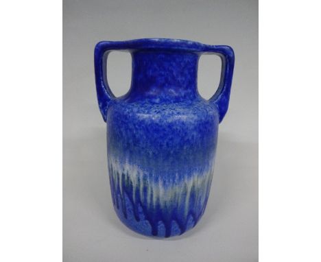 A RUSKIN POTTERY TWIN HANDLED VASE, having blue tonal crystalline glaze, impressed Ruskin, England 1951 and signed W Howson T