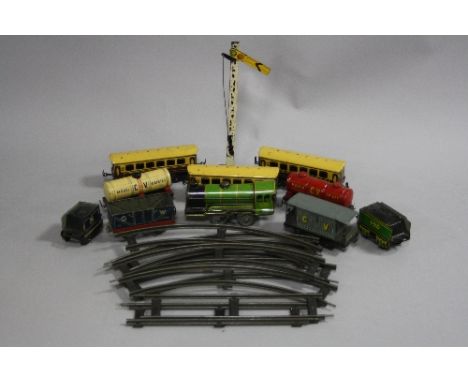 A QUANTITY OF UNBOXED TINPLATE O GAUGE CLOCKWORK CHAD VALLEY MODEL RAILWAY ITEMS, locomotive and tender, no. 490, green liver