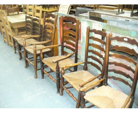An 18th Century oak and rush seated Macclesfield ladder back chair ,  second similar chair , a later elbow chair and 3 reprod