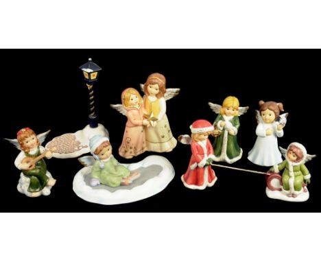 SEVEN GOEBEL FIGURES OF ANGELS AND TWO STANDS