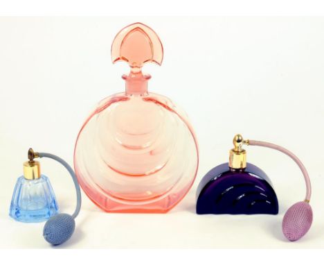 AN ART DECO CORAL TINTED GLASS SCENT BOTTLE AND STOPPER, 1930S AND TWO OTHERS, WITH ATOMISERS