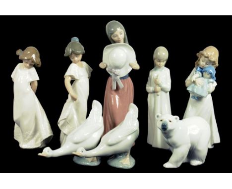 A LLADRO FIGURE OF A GIRL AND A LLADRO POLAR BEAR, FOUR NAO FIGURES AND TWO NAO GEESE