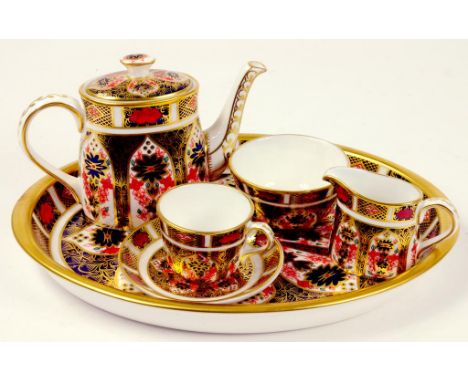 A ROYAL CROWN DERBY MINIATURE IMARI PATTERN TEA SERVICE AND OVAL TRAY