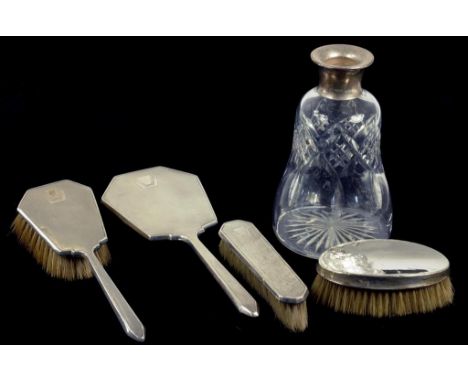 A GEORGE VI SILVER THREE PIECE BRUSH SET, ENGINE TURNED, BIRMINGHAM 1938, A SILVER BRUSH AND A SILVER MOUNTED CUT GLASS DECAN