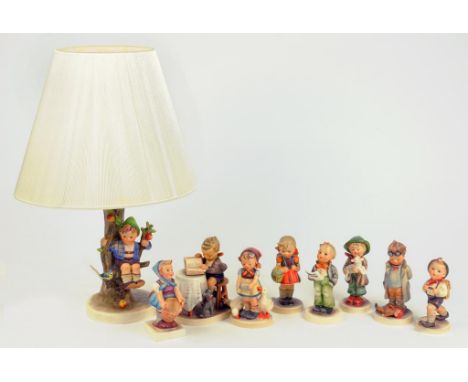 A GOEBEL TABLE LAMP AND EIGHT FIGURES OF CHILDREN, DESIGNED BY M.J. HUMMEL