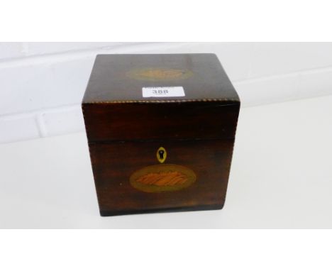A mahogany and chequer banded tea caddy of square form, the hinged lid with inlaid shell motif, 14 x 14 cm 
