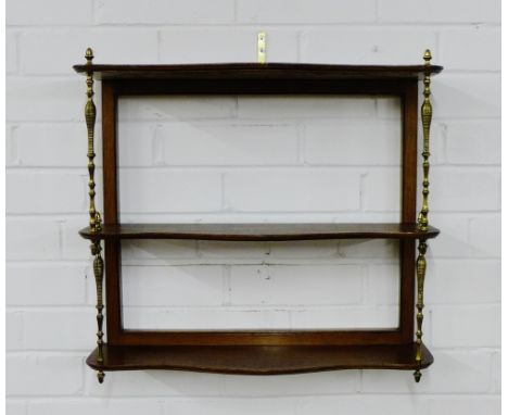 A mahogany wall shelf on turned brass supports, 48 x 54cm