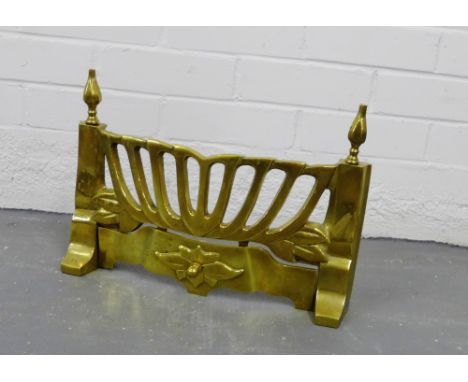 A brass fire grate