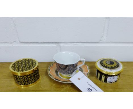 A Royal Copenhagen porcelain cup and saucer in pattern No.055, together with a Royal Worcester commemorative 2001 Collection 