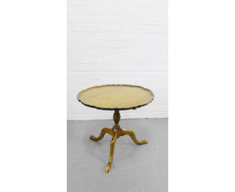 A mahogany tilt top table, the circular top with pie crust edge on turned column and tripod support, 48 x 56cm