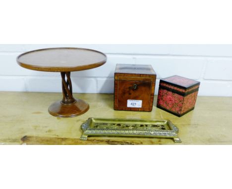 A mixed lot to include a small mahogany and inlaid caddy, together with a wooden comport, an Indian box and a brass pen tray 