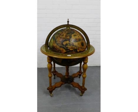 A reproduction globe bar on turned supports, 100 x 80cm