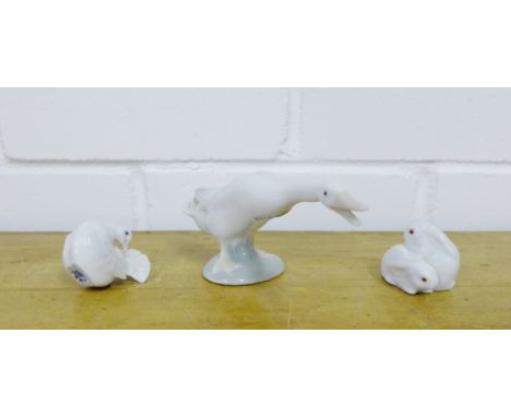 A Herend porcelain group of two hares, together with a Lladro goose and a Royal Copenhagen fan tailed bird (3) 