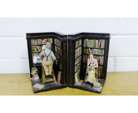 A pair of novelty resin book ends, modelled as a library interior with figures on a ladder (2) 