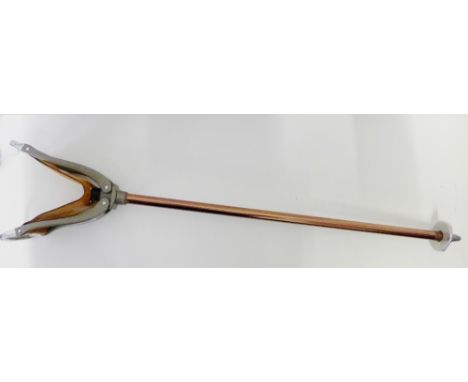 A chrome and leather shooting stick