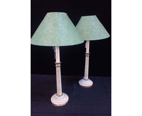 A PAIR OF PAINTED CANDLESTICK STYLE TABLE LAMPS with distressed gilding (for re-wiring)