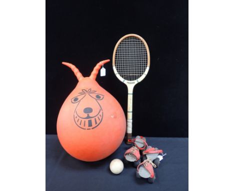 A VINTAGE SPACE HOPPER, A PAIR OF 1970s ROLLER SKATES a ball and a Lillywhite Frowd 'Princess' tennis racquet
