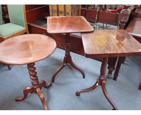 A 19th CENTURY ROSEWOOD TRIPOD TABLE with spiral turned stem and scrolled legs on brass ball feet 44cm wide (top loose) and t