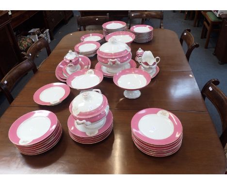 A LATE 19th CENTURY PARIS PART DINNER SERVICE with a pink rim and a monogram "M" (unmarked, some chips, wear)