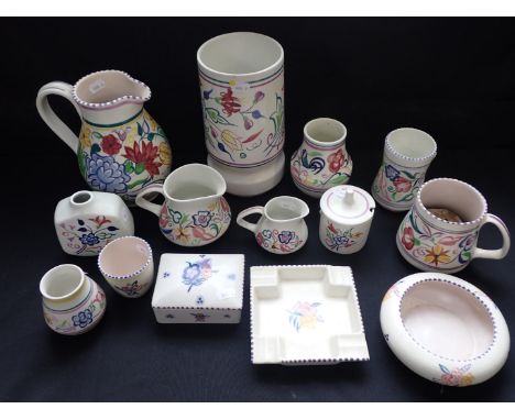 A COLLECTION OF POOLE POTTERY with traditional decoration, vases, jugs etc