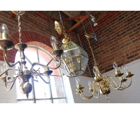 AN EIGHT-BRANCH DUTCH STYLE BRASS CHANDELIER (modern), another smaller five-branch, and a hall lantern with bevelled glass, a