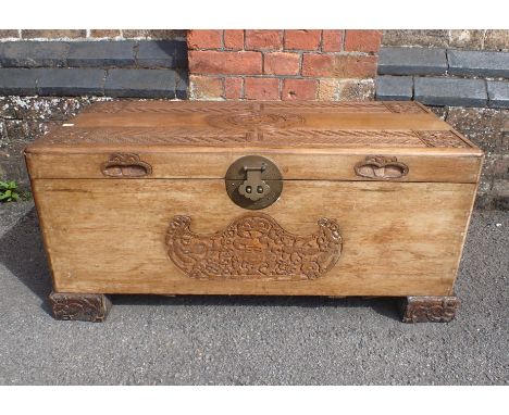 A CHINESE CAMPHORWOOD TRUNK FOR THE NEW ZEALAND MARKET with fine Maori style carving and a central carved kiwi to the lid 90c