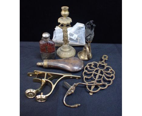 A BRASS FIGURAL CANDLESTICK with other metal wares including a powder horn, a spirit flask, curtain pole brackets etc