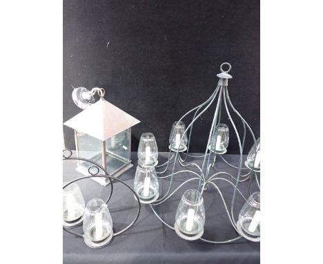AN ARTS AND CRAFTS STYLE COPPER FRAMED PORCH LANTERN glazed, with pyramidal top and shaped base 43cm high, a modern eight-lig