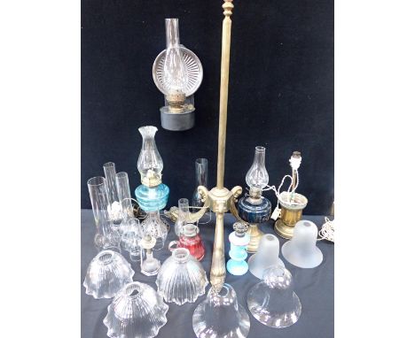 A BRASS STANDARD LAMP WITH DOLPHIN FEET three Holophane lampshades (minor chips), Edwardian electric light shades, oil lamps 
